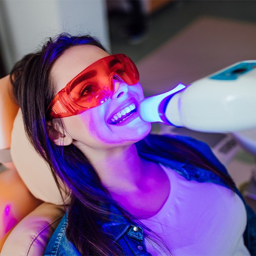 Female patient receiving in-office teeth whitening 